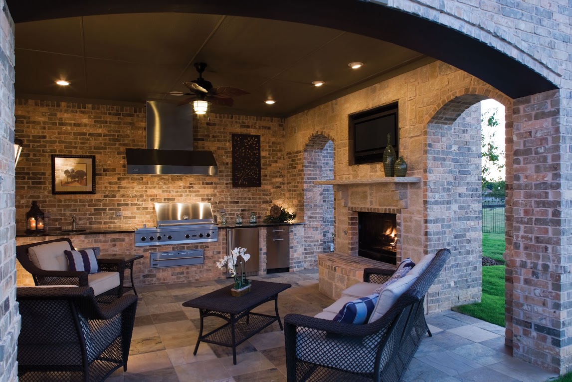 outdoor fireplace installation with outdoor kitchen